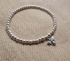 Sterling silver beaded stretch bracelet with antique detailed bumble bee charm