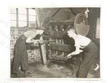 2 Men Operating Heavy