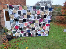 Lap quilt, black/white/bright colours, disappearing 9 patch, machine quilted