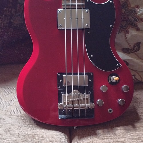 Red solid body electric bass - solid,