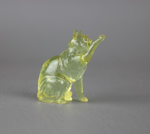 Yellow clearware pawing cat - pawing,