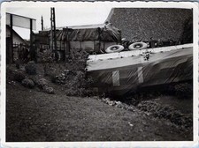 WW2 Photo Overturned German Army Truck Beside Fence with Soldiers Observing