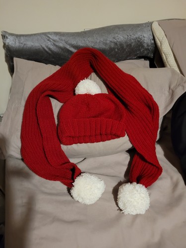 Hand knitted scarf and - hand,