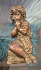 Bronzed Seated Cherub Figurine