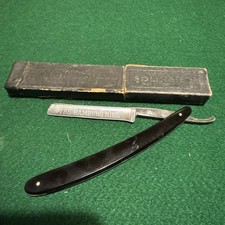 Used.  Antique straight blade