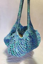 Handmade crochet mesh market bag, blue/green variegated yarn. 