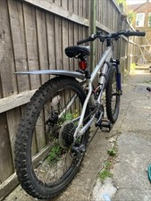 Carrera Luna Junior Mountain Bike 24-inch blue/grey used. Back break needs fixed