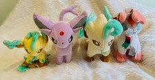 A selection of 4 Pokemon  plush soft toys - proceeds to charity