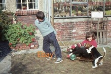 35mm Slide - Young Boy Pulling Young Girl In Trolley In Garden, 1964