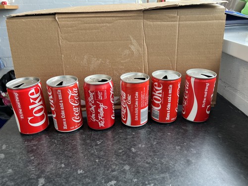 Vintage empty coke cans from - 6,