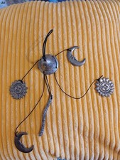 Silver coloured Moon and Sun wind chime