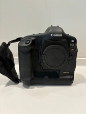 Canon EOS-1 Ds with handle and manual