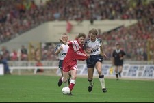 Steve McManaman of Liverpool has shirt pulled by Gary Owers of Sun- Old Photo