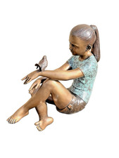 Bronze girl sitting with bird aged bronze young girl statue outdoor figure youth