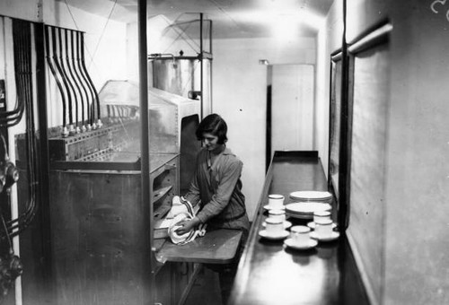 Maid prepares dish kitchen - prepares,