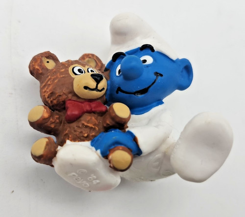 Smurf baby holding teddy bear - holding,