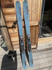 Salomon QST 98, 183cm with Marker Tour 12 bindings and Geko skins.