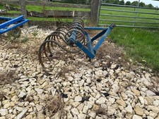 Tractor spring tyne harrow for