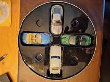James Bond Collectible Cars Tin. 4 Cars In Perfect Condition But Tin Worn