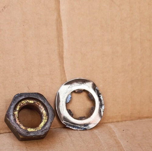 Front engine sprocket nut - engine,