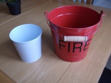 2 METAL PLANTERS. 1 SMALL FIRE BUCKET, 1 SMALLER WHITE POT