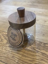 Glass honey jar with a wooden