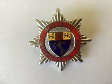 Gwynedd Fire Brigade cap badge