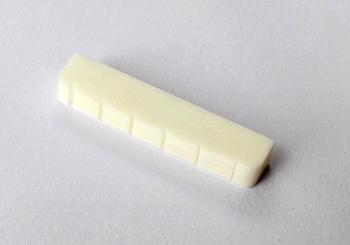 Genuine real bone nut slotted - bone,