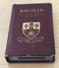 Dark red money box from the Anglia Building Society locked no key