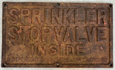 Antique cast iron street sign - 'SPRINKLER STOP VALVE INSIDE'