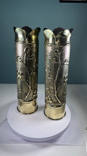 Pair artillery shell - of,