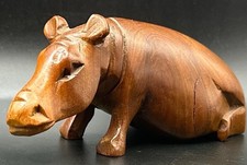 Hand carved wooden hippo - hand,