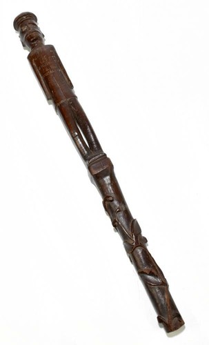 Carved cane present - a, from