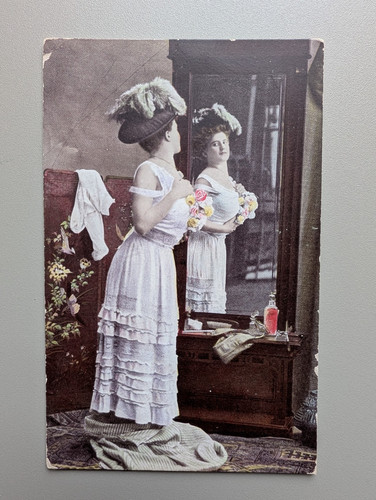 Old postcard woman dressing - postcard,