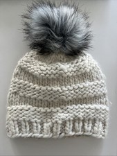 An ‘Alice Hannah Women’s Knitted Cream Bobble Hat