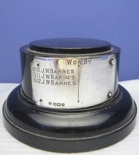 ROUND EBONISED WOODEN PLINTH / TROPHY STAND WITH STERLING SILVER PLAQUE