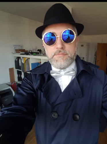 Blue coat and glasses