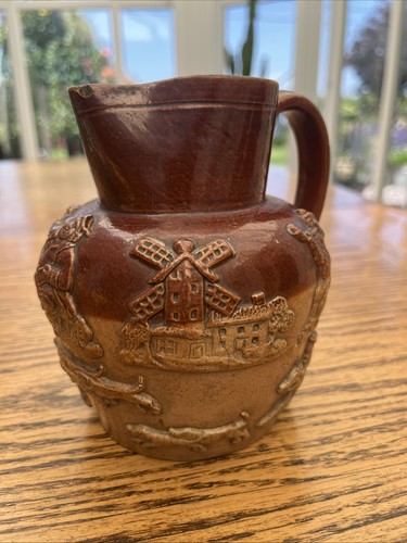 Stoneware pitcher featuring - stoneware,