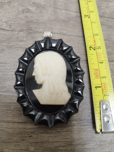 Whitby jet pendant with hand
