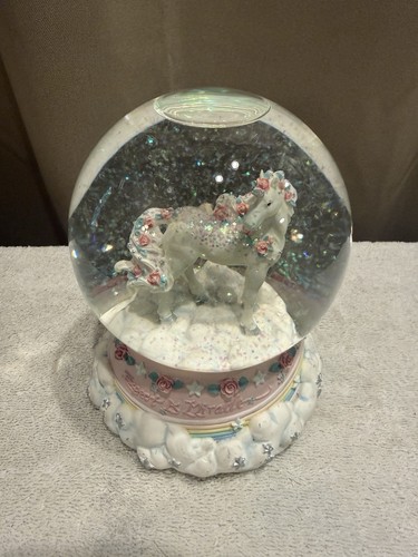 Unicorn snow globe plays - globe,