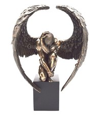 Winged nude male - angel, sitting