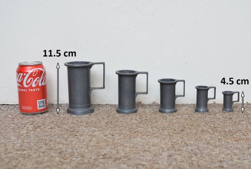 Old pewter measuring jugs - measuring,