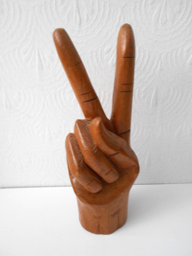 Hand carved wooden peace sign
