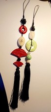 Oriental decorative hangings carved stones green,red,cream with tassels X 2