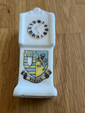 crested grandfather clock -