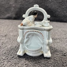 Antique Lidded Trinket Box German Fairing, C19th, infant on top a Mantelpiece