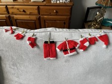 Father Christmas/Santa hand knitted/crochet washing line decoration/bunting pegs