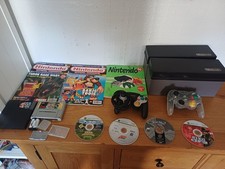 Variety Of Gameing Stuff. Games, Cases, Control Pads Also Magazines.