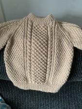 Hand knitted childs aran