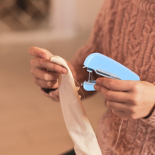 Hand held sewing device - ,